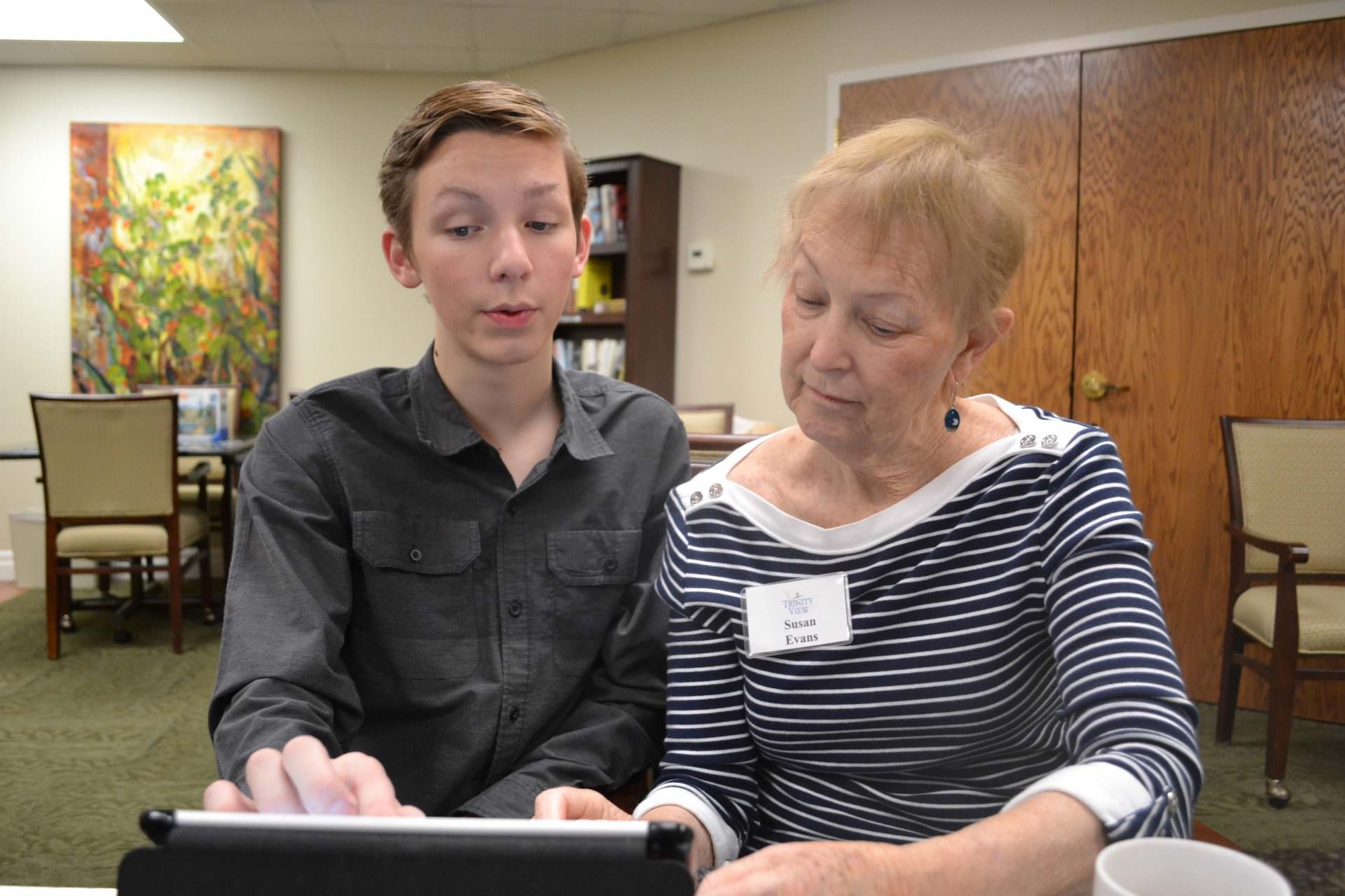 Staying connected: Teenager helps Trinity View residents with technology